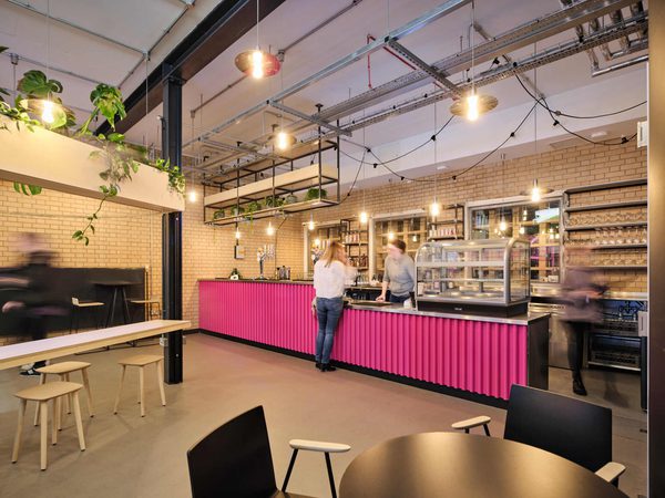 The Contact cafe with a customer being served at the bar