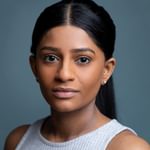 A young woman of Indian descent with a grey top